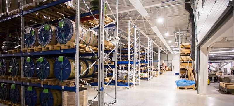 Palletised stock held on warehouse racking, wrapped and tagged, waiting on a disposition.